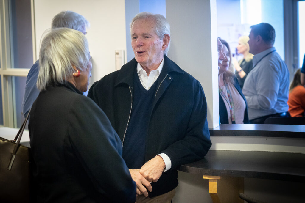 Russ Read speaks with a member of the meeting.